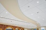 ULTIMA High-NRC Ceiling Panels / SUPRAFINE 9/16" Suspension System / Drywall Grid System / SimpleCurve trim / AXIOM Classic 6" Trim
